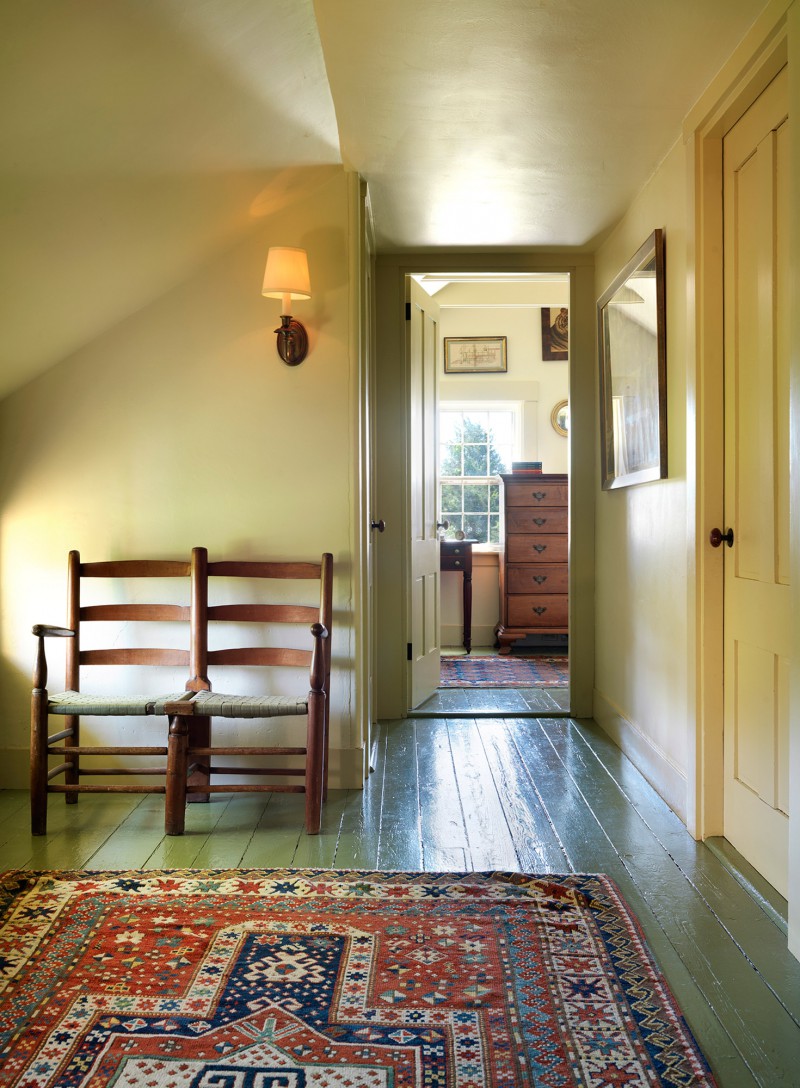 sunny hallway leading to bedroom Original plank floors