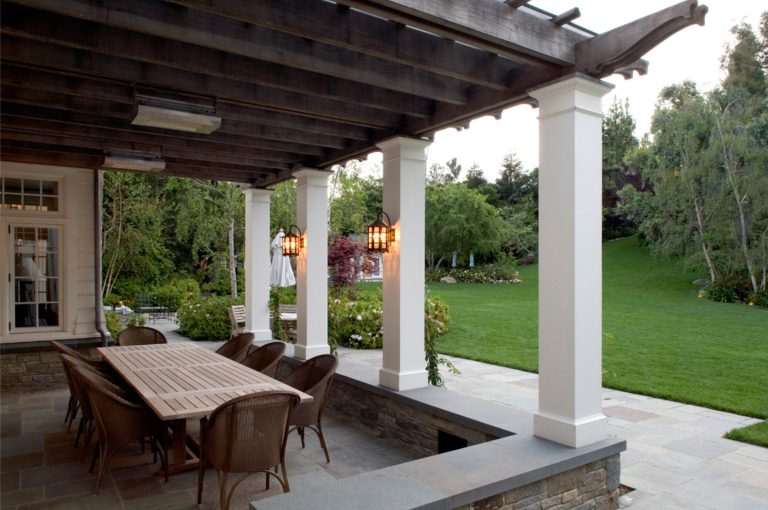 patio designed for living and dining with custom light fixtures