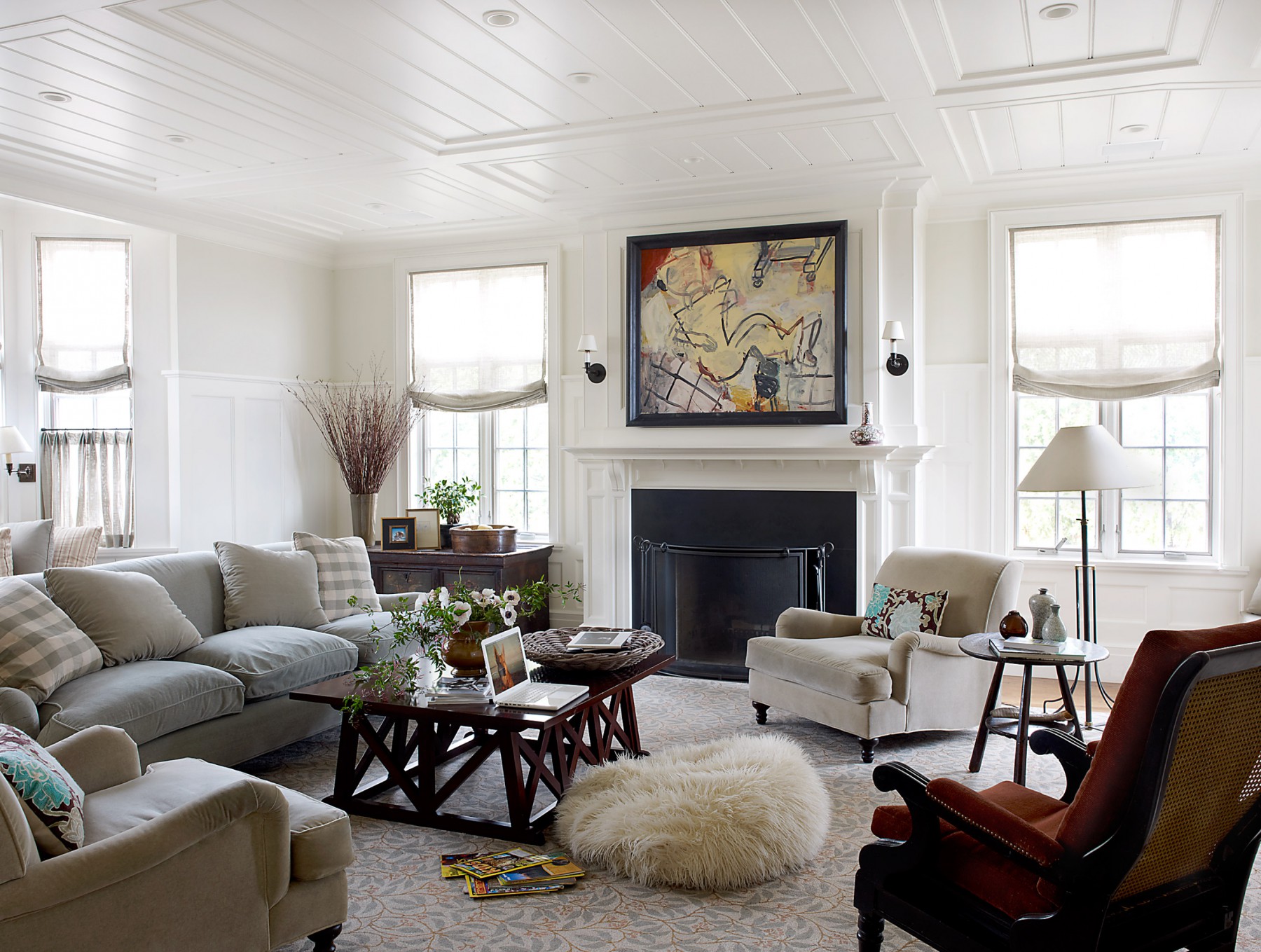 Living room with fire place and custom designed paneling and molding
